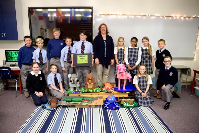 WPS teacher Amanda Lynch and her students shown with their robotic animals are in back (l-r) Ben McGovern, Salisbury, Md.; Gavin Riddle, Millsboro; James Haley, Bethany Beach; Ryan Mann, Bishopville, Md.; Jack Lynch, Ocean City, Md.; Amanda Lynch; Jayden Scopp, Berlin, Md.; Emaan Ehtasham, Lewes; Jennifer Kimbrew, Ocean City; and Aleksey Klimins, Ocean City. In front are Isabella Metz, Rehoboth Beach; Briar Parsons, Pittsville, Md.; Lillian Doran, Seaford; Jackson Fernley, Berlin, Md. SUBMITTED PHOTO